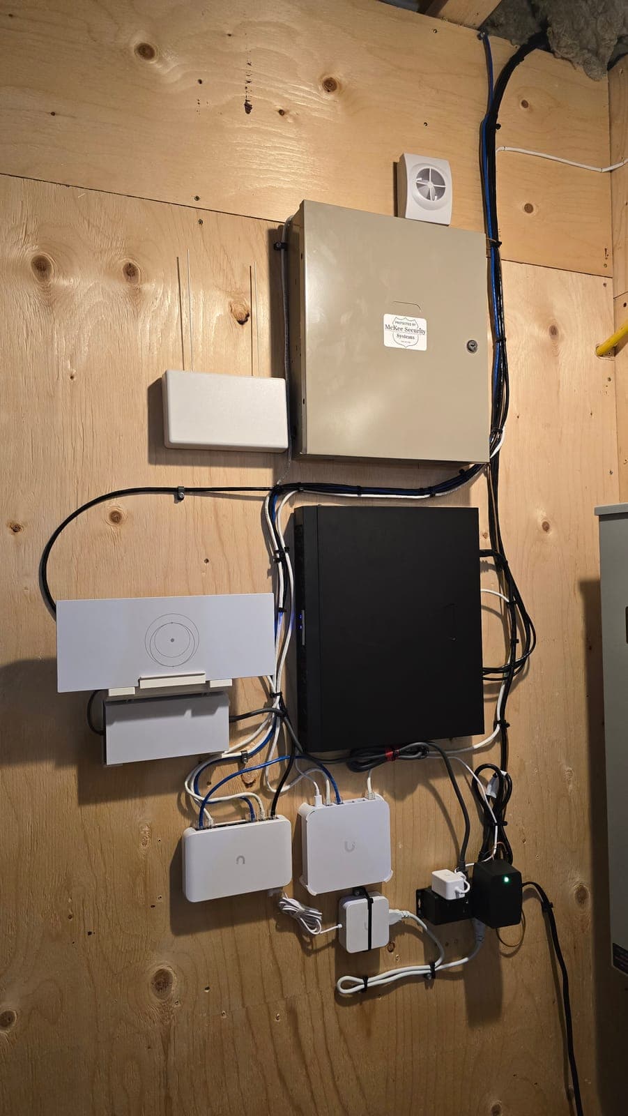 Alarm panel and smart hub installed on a wall